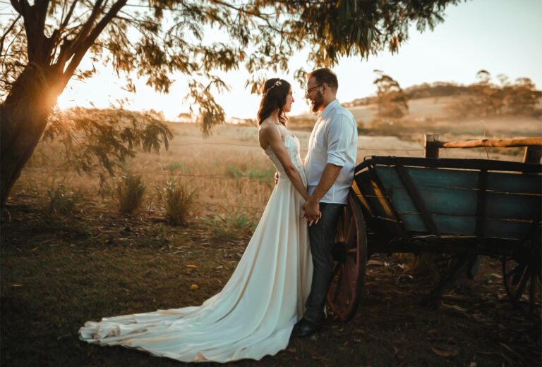 a man and woman standing next to a cart