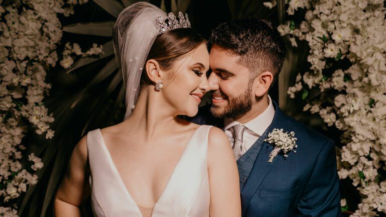 a bride and groom standing next to each other