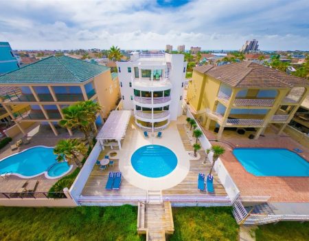 an aerial view of a house with a swimming pool