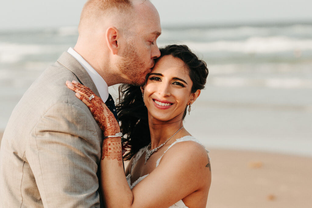 a man kissing a woman on the cheek